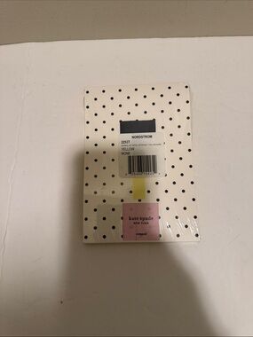 kate spade white and black polka dot notepad with yellow tab